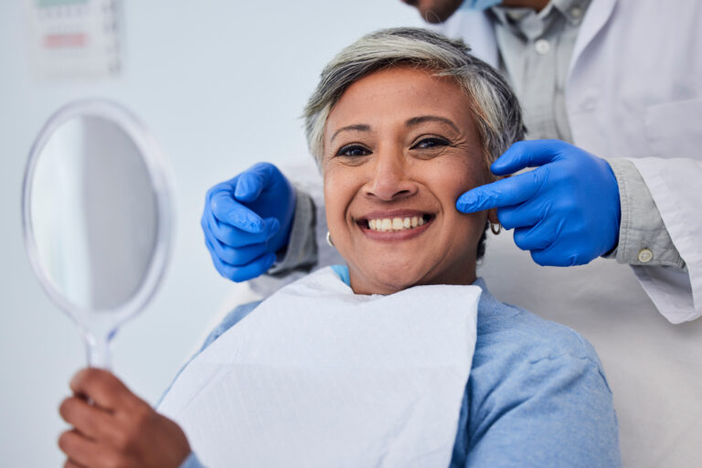 Happy senior woman, teeth and dentist for dental care, appointment or checkup at clinic. Portrait of elderly female person smile for tooth whitening, cleaning or oral, mouth and gum care at hospital.